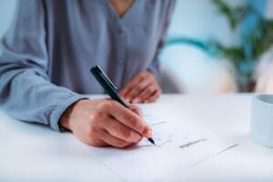 Photo of older adult taking an assessment to measure cognitive impairments
