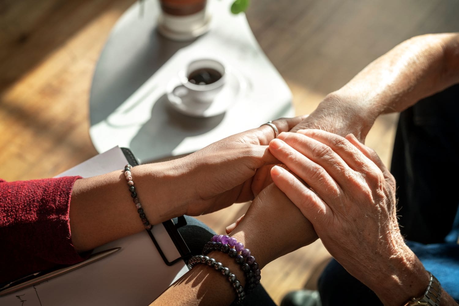 Photo of caring hands at the office of Ginny Estupinian PhD geriatric psychologist providing therapy for older adults