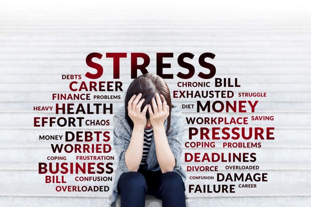 Photo of all types of stress falling all around a woman. The office of Ginny Estupinian PhD treats stress.