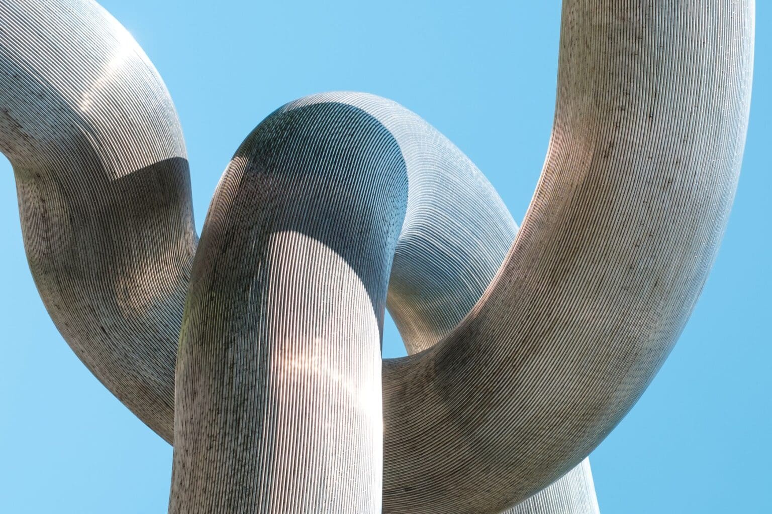Photo of a twisted concrete structure depicting the complexity of people dealing with divorce. Ginny Estupinian PhD helps people going through divorce and rebuilding after divorce.