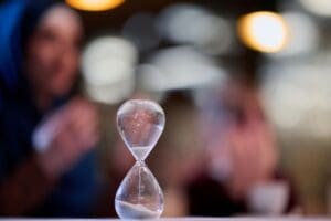 Photo of hourglass with time passing to illustrate how important timely assessment of adult ADHD by Ginny Estupinian PhD