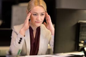 Photo of businesswoman having trouble concentrating due to depression